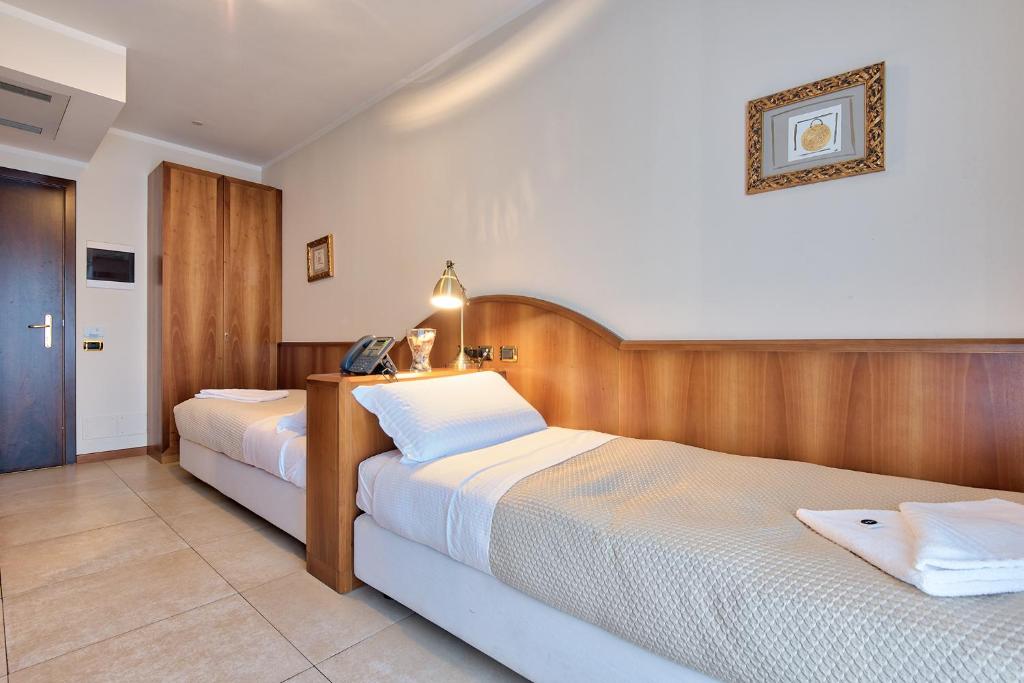 Posteľ alebo postele v izbe v ubytovaní Albergo Villa Priula