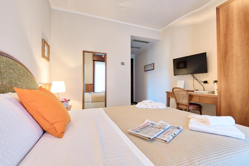 Posteľ alebo postele v izbe v ubytovaní Albergo Villa Priula