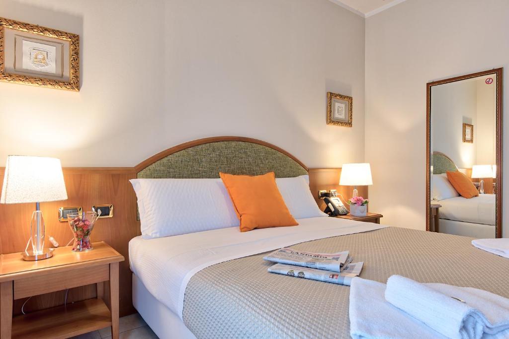 Posteľ alebo postele v izbe v ubytovaní Albergo Villa Priula