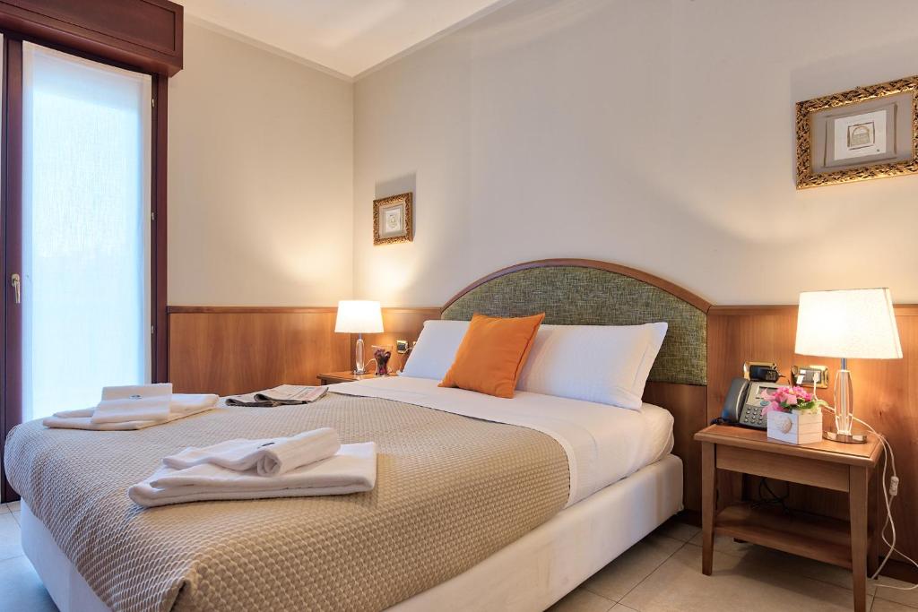 Posteľ alebo postele v izbe v ubytovaní Albergo Villa Priula