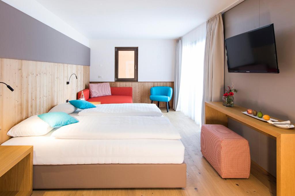 Postel nebo postele na pokoji v ubytování Hotel Palü