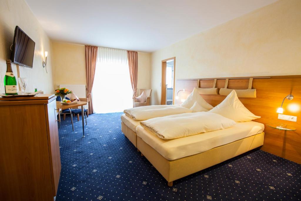 Postel nebo postele na pokoji v ubytování Landgasthof-Hotel Zum Steverstrand