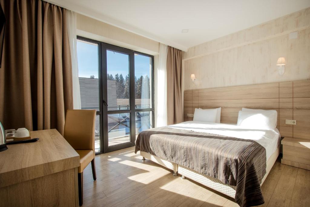 Postel nebo postele na pokoji v ubytování BM Plaza
