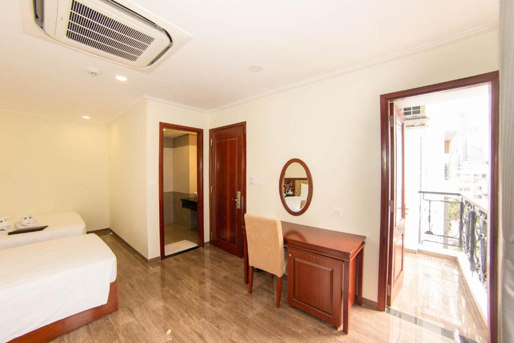 Postel nebo postele na pokoji v ubytování Trường Hải Hotel