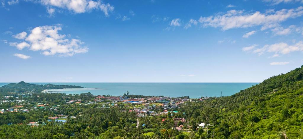 a view of a town on a hill at Stunning sea view villa Lamai Koh Samui in Lamai