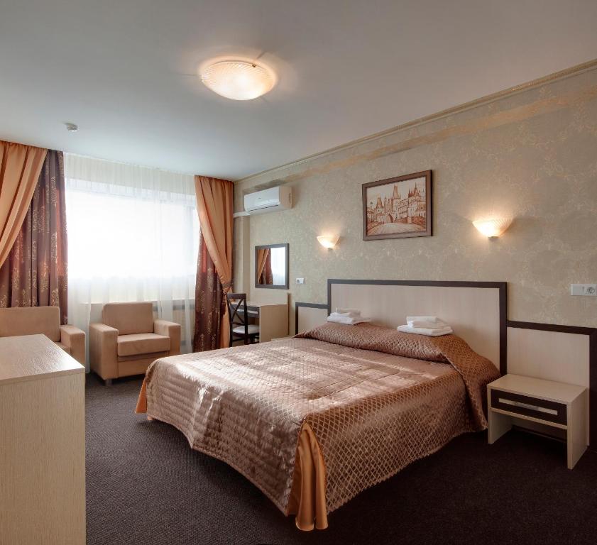 
Кровать или кровати в номере Гостиница Металлург
