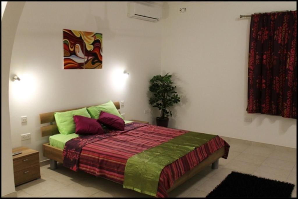 Postel nebo postele na pokoji v ubytování Villa Naxxar Malta