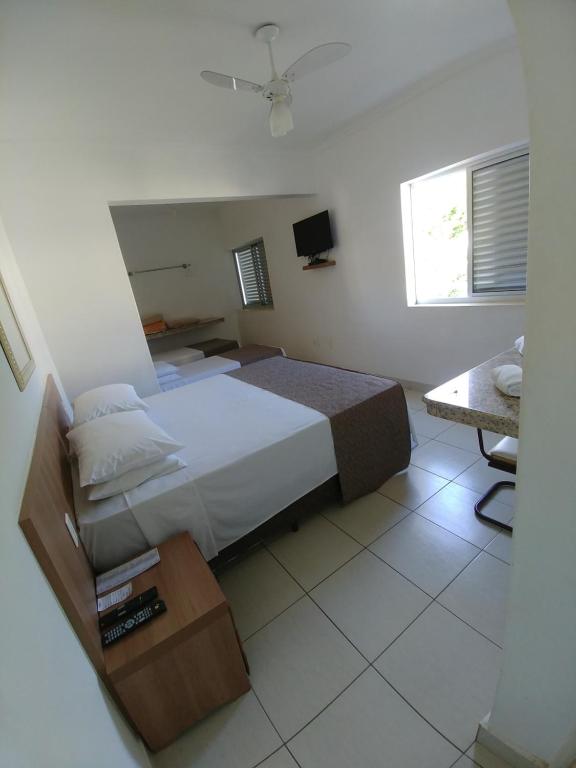 Posteľ alebo postele v izbe v ubytovaní Hotel Ouro Verde