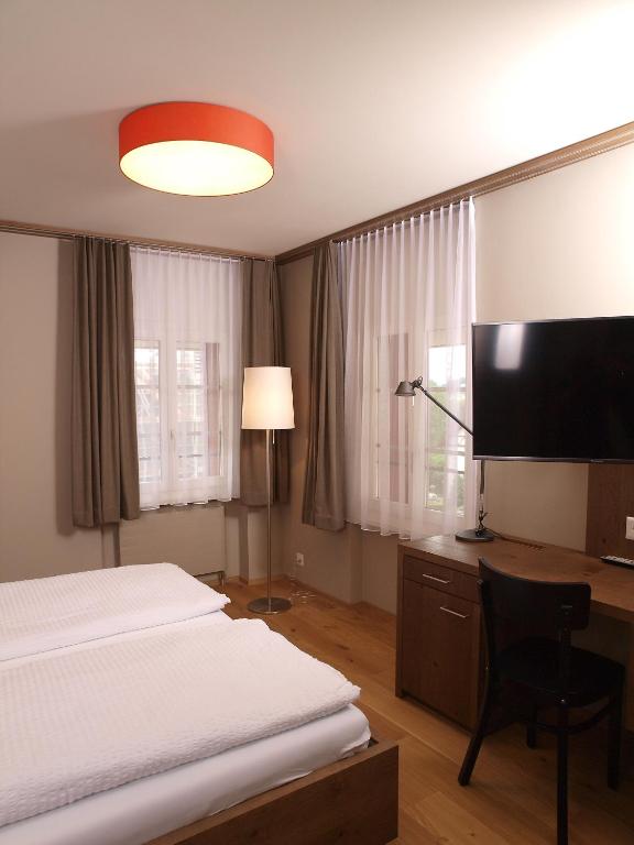 Postel nebo postele na pokoji v ubytování Hotel Bären