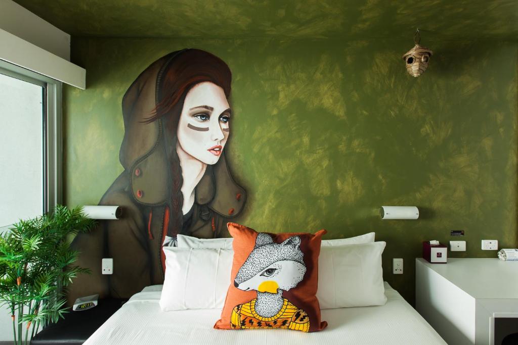 Postel nebo postele na pokoji v ubytování Majestic Minima Hotel