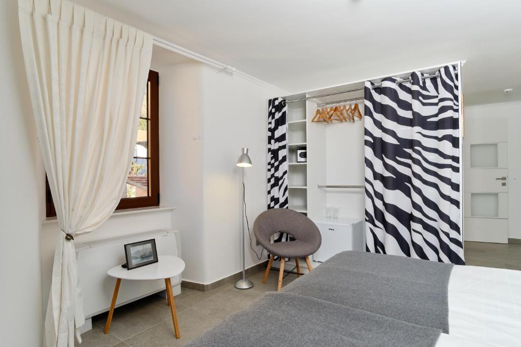 Postel nebo postele na pokoji v ubytování Apartments Zebra