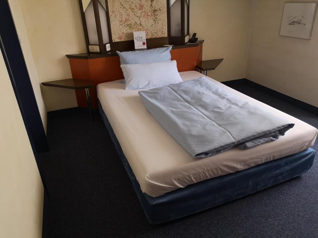 Postel nebo postele na pokoji v ubytování Main Hotel Eckert 3-Sterne Superior
