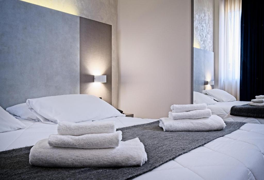 Voodi või voodid majutusasutuse Albergo Papillon toas