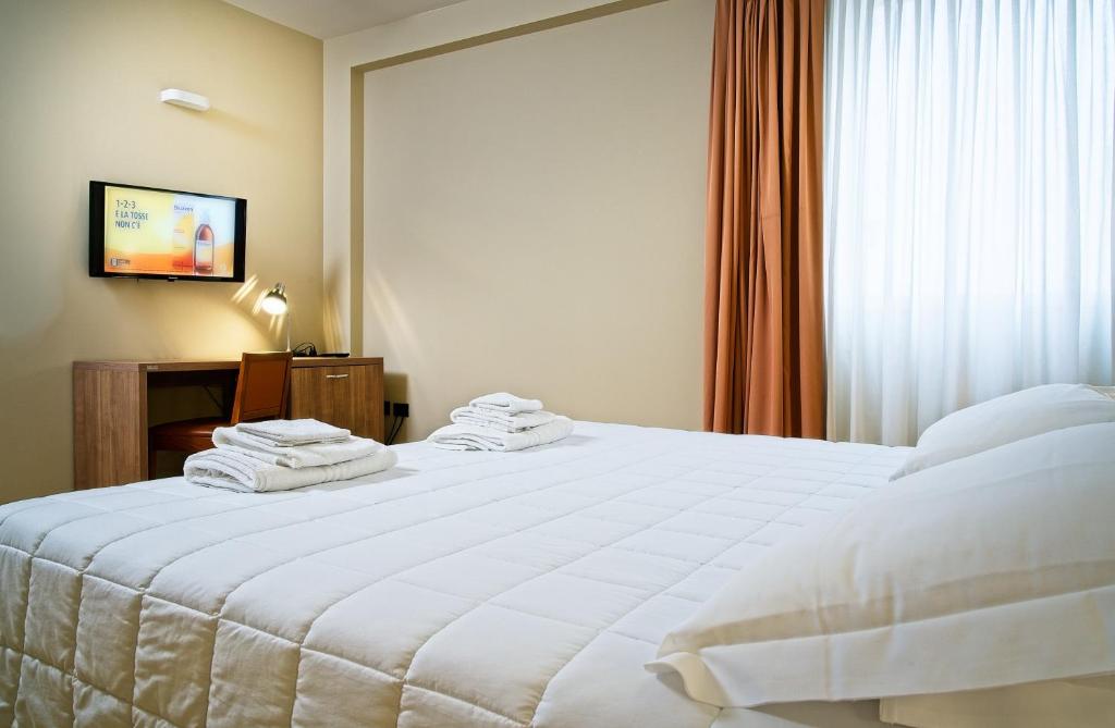 Voodi või voodid majutusasutuse Albergo Papillon toas