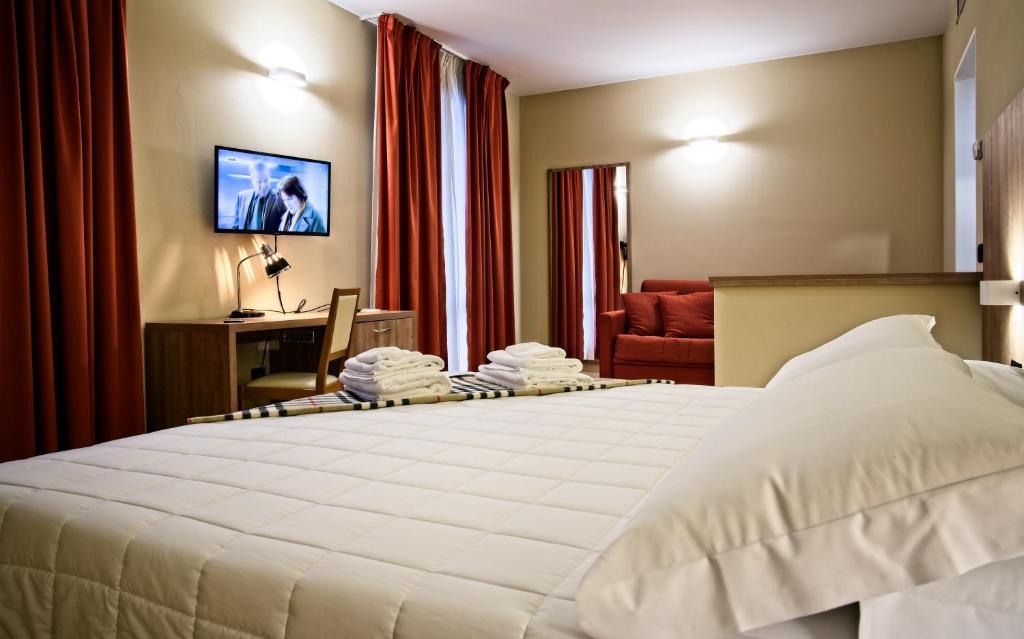 Voodi või voodid majutusasutuse Albergo Papillon toas