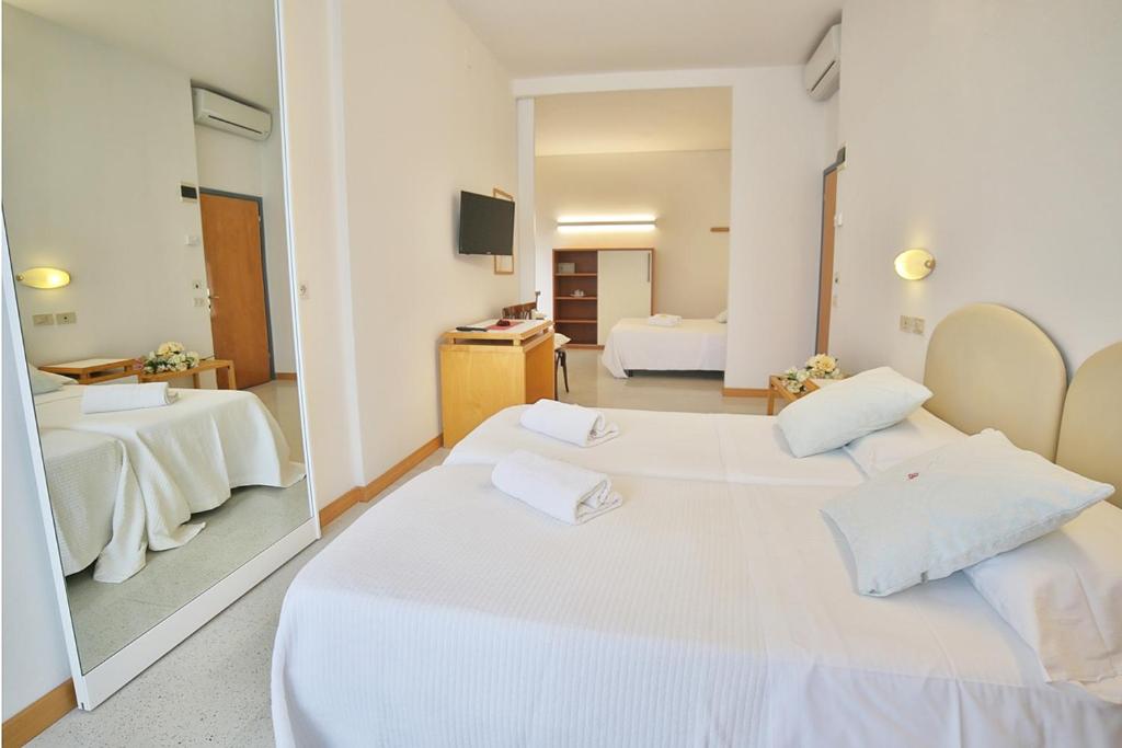 Postel nebo postele na pokoji v ubytování Hotel Pinocchio