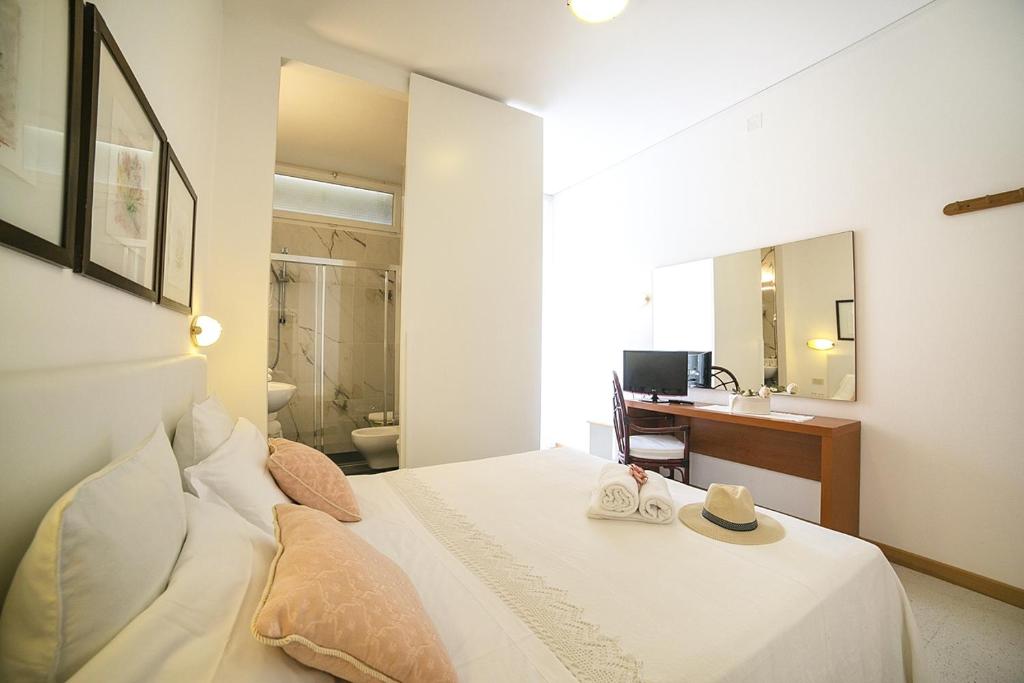 Postel nebo postele na pokoji v ubytování Hotel Pinocchio