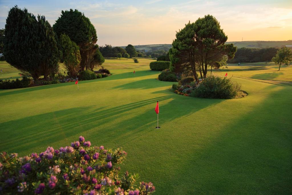 an overhead view of a golf course with a red flag at Bowood Park Hotel in Camelford
