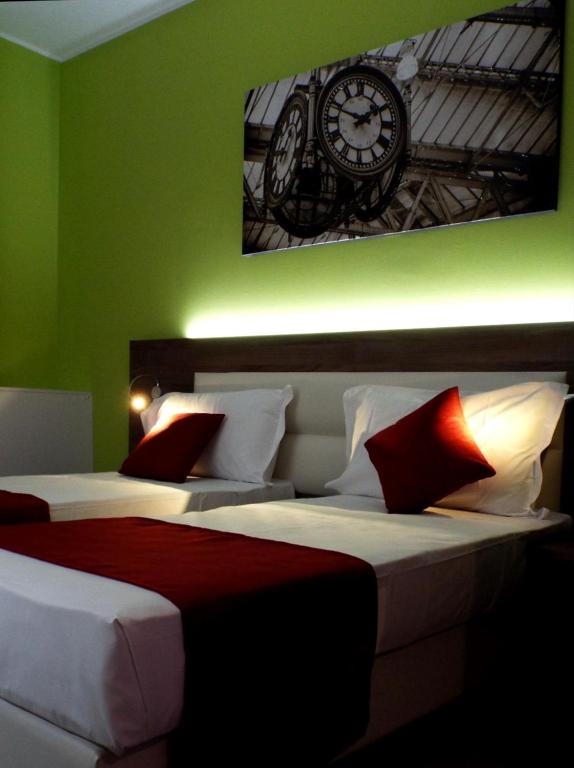 Postel nebo postele na pokoji v ubytování Hotel Stradivari