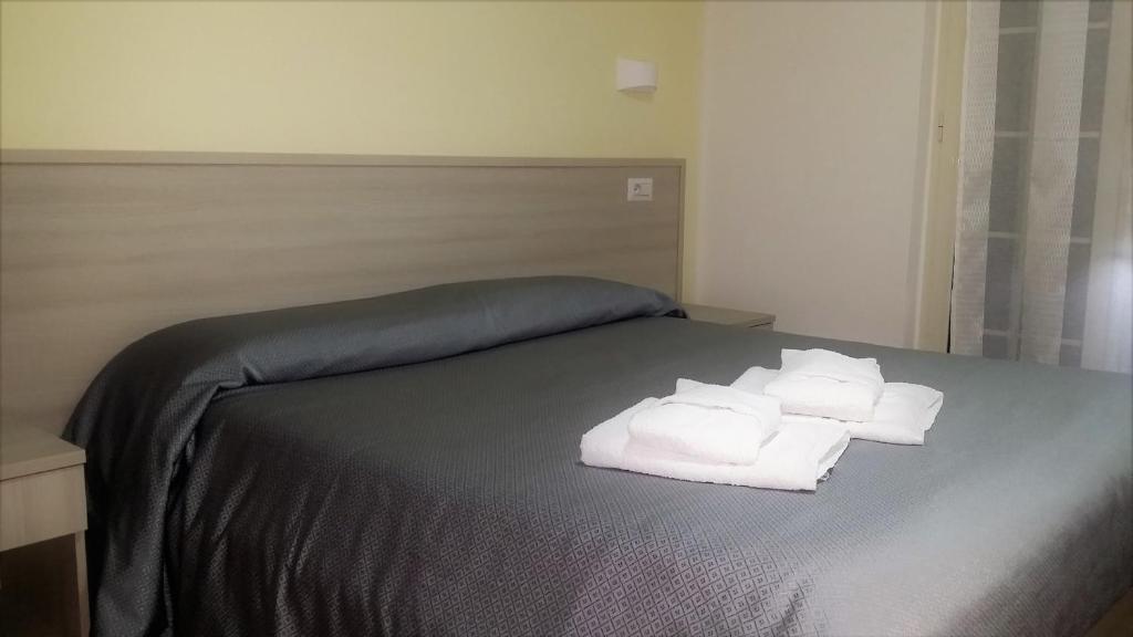 Postel nebo postele na pokoji v ubytování Guesthouse Holiday Formia beach