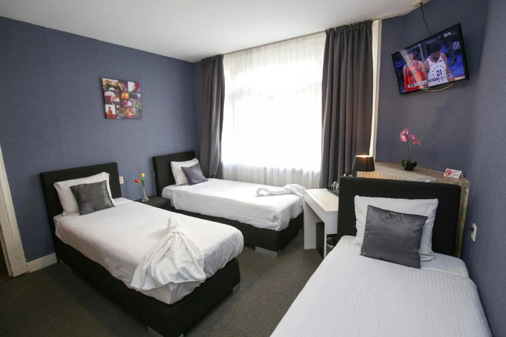 Postel nebo postele na pokoji v ubytování Hotel Flipper Amsterdam