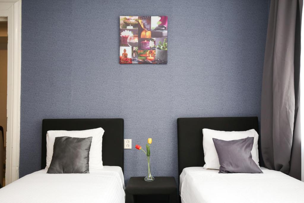 Postel nebo postele na pokoji v ubytování Hotel Flipper Amsterdam