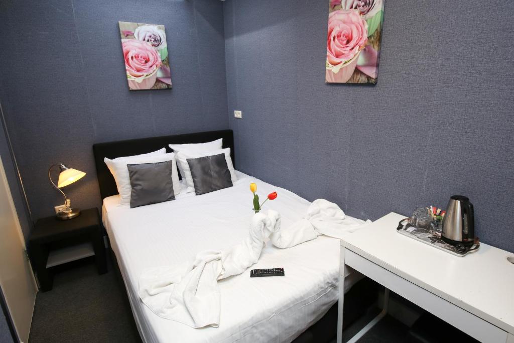 Postel nebo postele na pokoji v ubytování Hotel Flipper Amsterdam