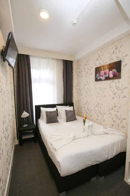 Postel nebo postele na pokoji v ubytování Hotel Flipper Amsterdam