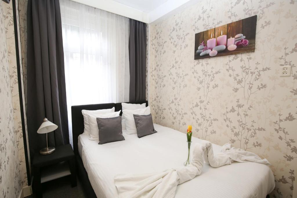 Postel nebo postele na pokoji v ubytování Hotel Flipper Amsterdam