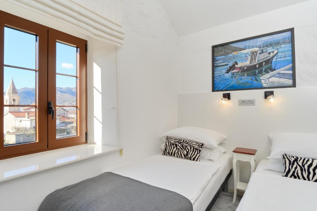 Postel nebo postele na pokoji v ubytování Apartments Zebra