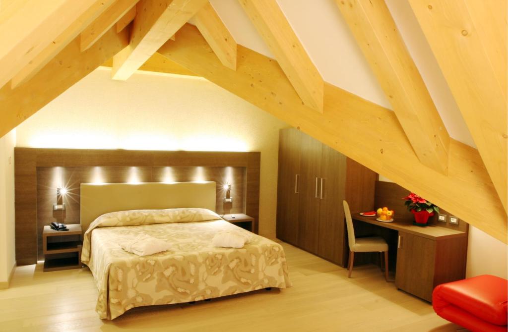 Postel nebo postele na pokoji v ubytování Grand Hotel Miramonti