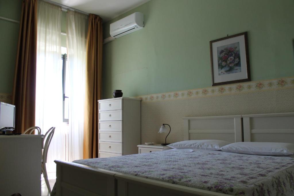 Posteľ alebo postele v izbe v ubytovaní Hotel La Villa