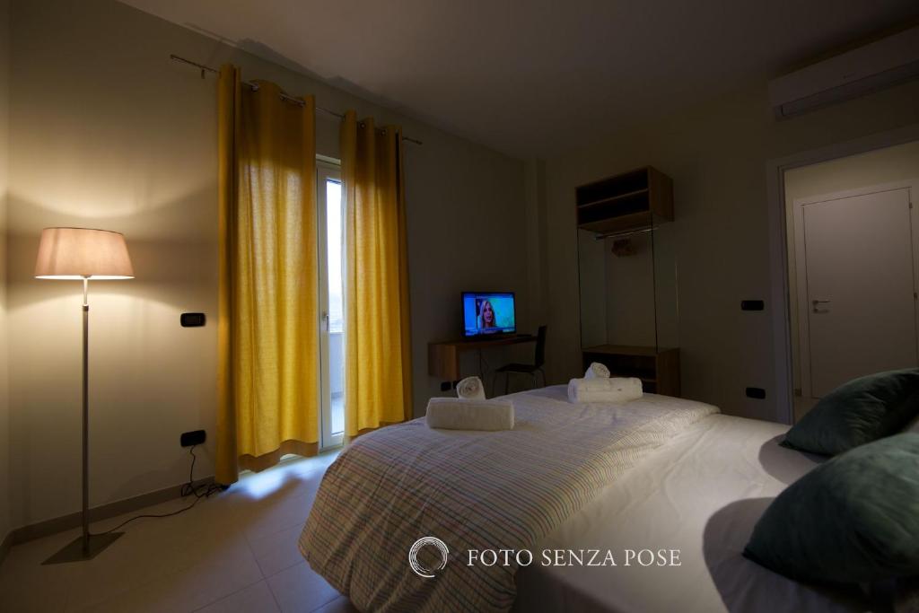 A bed or beds in a room at lepini suites affittacamere