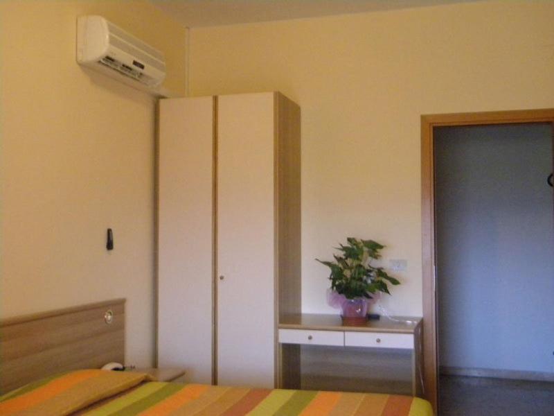 Кровать или кровати в номере Hotel Rosa Del Tirreno