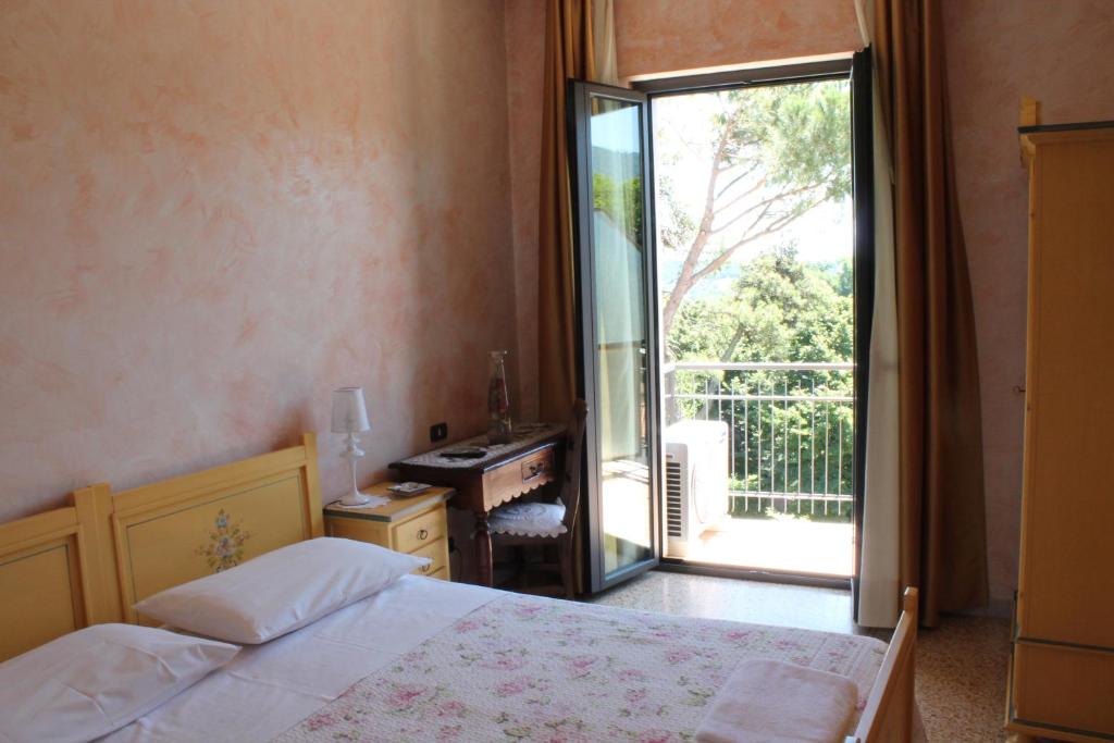 Posteľ alebo postele v izbe v ubytovaní Hotel La Villa