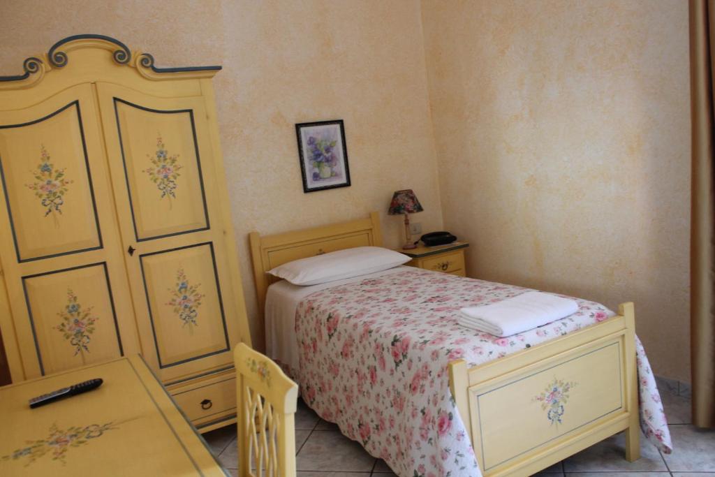 Posteľ alebo postele v izbe v ubytovaní Hotel La Villa