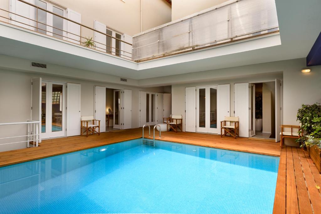 a large pool in a building with at Casas Da Formiga - Riverview Terrace and Pool in Porto