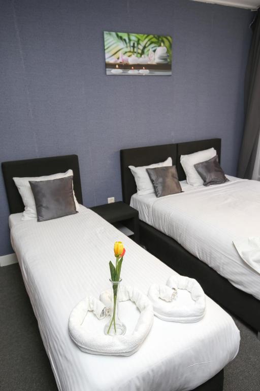 Postel nebo postele na pokoji v ubytování Hotel Flipper Amsterdam