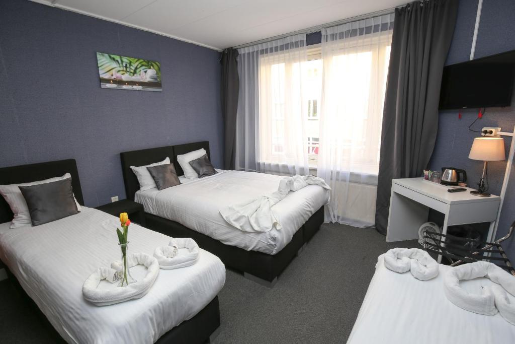 Postel nebo postele na pokoji v ubytování Hotel Flipper Amsterdam