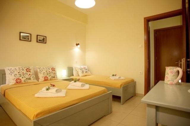 Postel nebo postele na pokoji v ubytování Hotel Dimoula