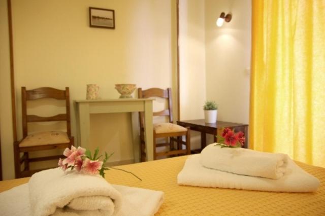 Postel nebo postele na pokoji v ubytování Hotel Dimoula