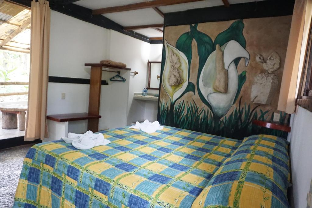Postel nebo postele na pokoji v ubytování Hotel Cabañas Safari