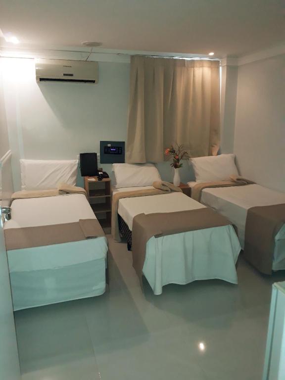 Postel nebo postele na pokoji v ubytování Hotel Sempre Bahia