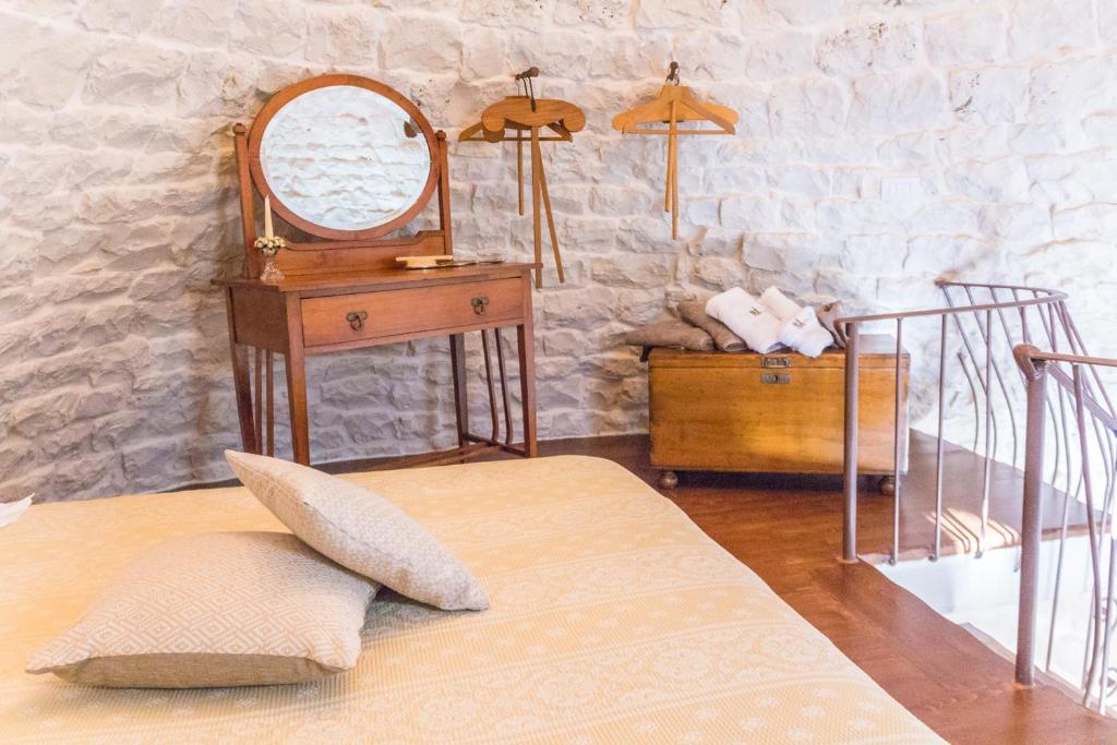 Posteľ alebo postele v izbe v ubytovaní Navolte Trulli e Quiete con Piscina