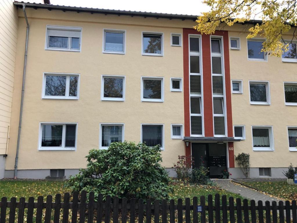 an apartment building with a fence in front of it at International 2 in Bad Harzburg