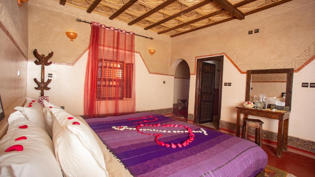 Postel nebo postele na pokoji v ubytování Ecolodge l'île de Ouarzazate