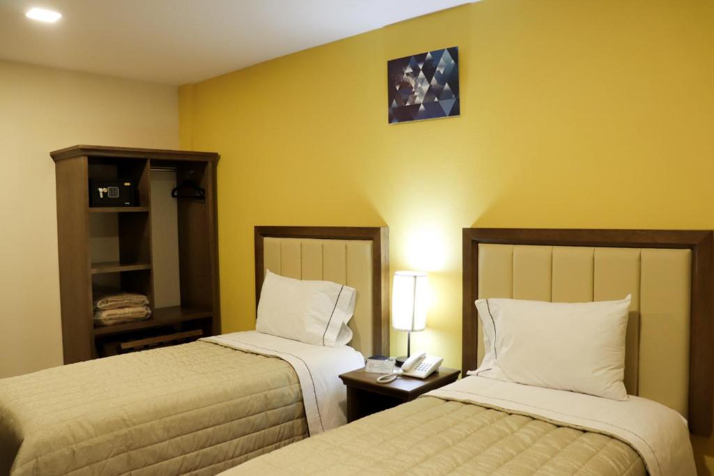 Postel nebo postele na pokoji v ubytování Hotel JYE by Serranillo, Mineral del Monte Hgo