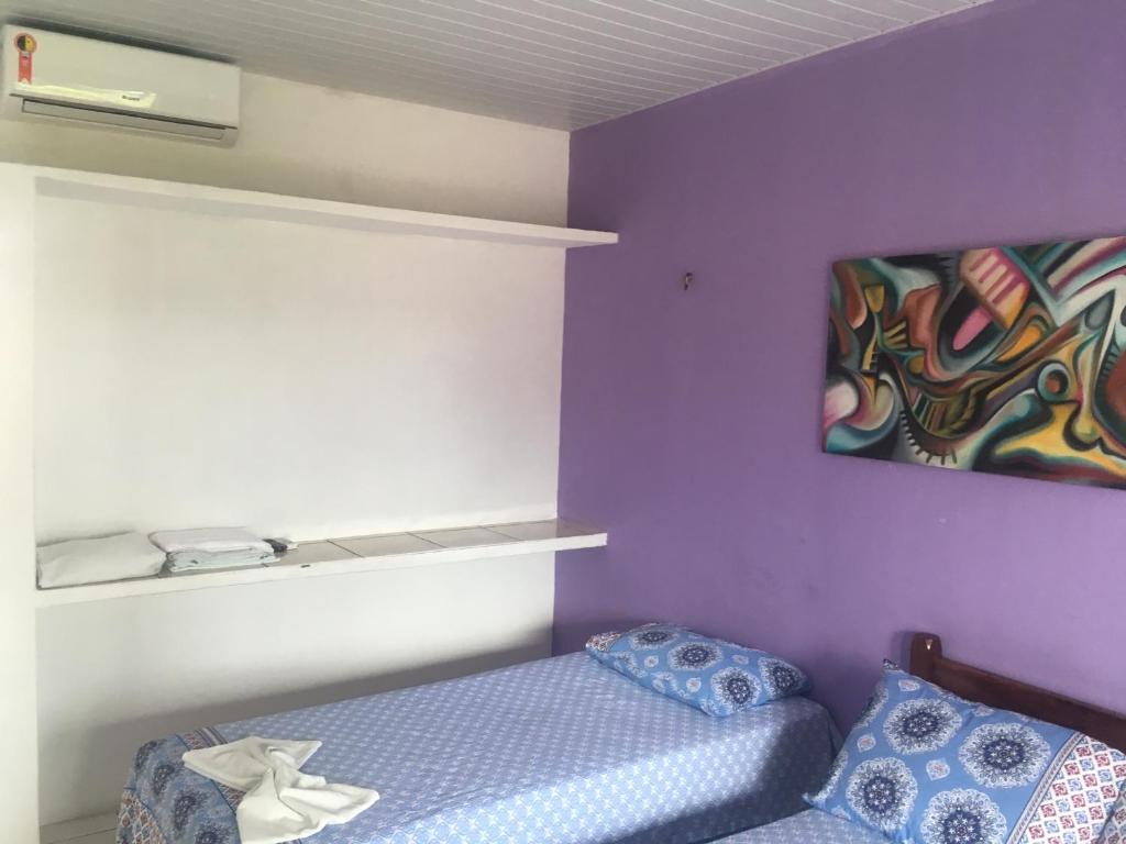 Postel nebo postele na pokoji v ubytování Pousada Brilho da Lua