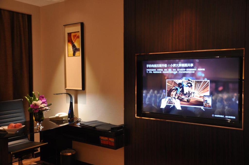 TV a/nebo společenská místnost v ubytování Shenzhen Sunshine Hotel, Luohu