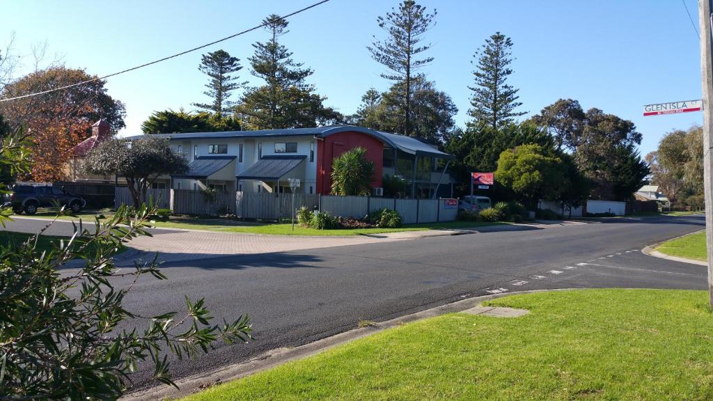 a house on the side of a road at Apartments At Glen Isla in Cowes